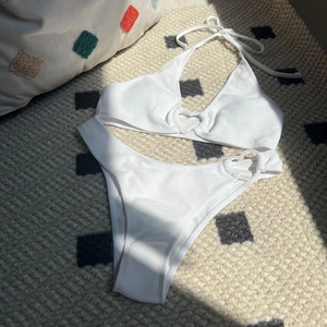 White heart buckle bikini set featuring honeycomb textured fabric and high cut bikini bottoms