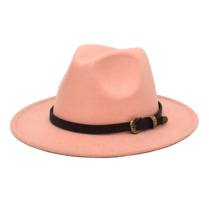 Close-up of pink wool fedora hat featuring a brown leather belt with golden vintage buckle