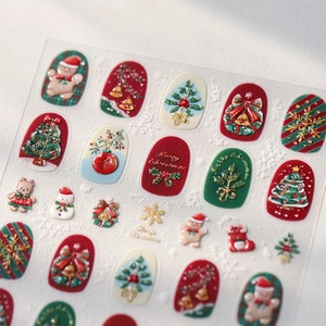 3D embossed Christmas nail art stickers featuring Santa, gingerbread men and festive patterns