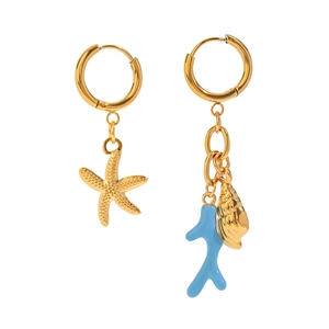 Asymmetric gold ocean earrings with starfish, shell and blue coral charms on white backdrop
