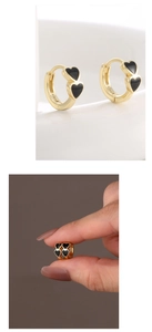 Macro shot of S925 sterling silver stamp on a 14K gold double heart enamel earring