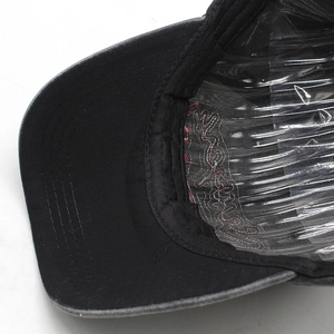 Close-up of internal stitching and NY embroidery inside a washed cotton baseball cap