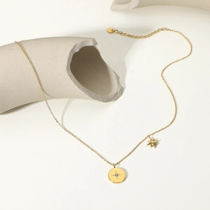 Elegant 18K gold plated stainless steel necklace with starburst and zircon pendant