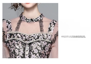 Detail of floral dress with pearl beading, lace high neck, and sheer mesh sleeves