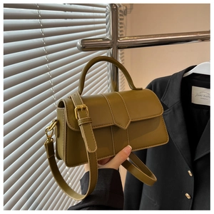 Close-up of olive green PU leather shoulder bag with sleek finish and gold hardware