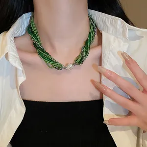 Green layered crystal bead necklace with sparkling diamond-set sphere buckle for women