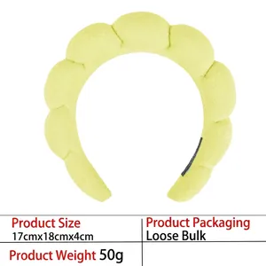 Detail showing dimensions and soft plush texture of the light green padded sponge headband