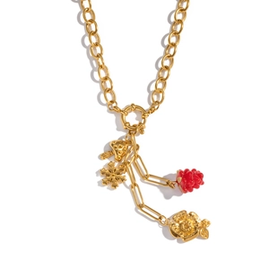 Close-up of 18K gold-plated chain necklace with mushroom, flower, and red berry pendants