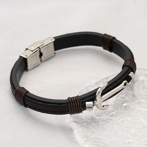 Men's leather cross strap bracelet with silver anchor charm and stainless steel buckle