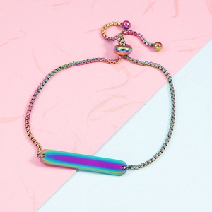 Close-up of rainbow plated stainless steel bar bracelet with adjustable box chain slide