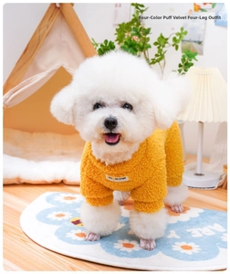 Close-up of yellow fleece pet pajamas with pet partner patch in a cozy home setting