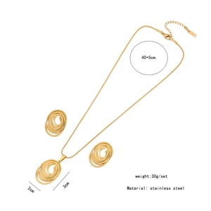 Macro detail of golden irregular spiral pendant necklace and earring set with dimensions