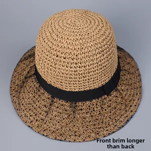 Detail of summer straw hat showing the asymmetrical brim longer in front and shorter in back