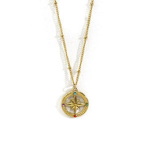 Detail of 14K gold 316L stainless steel star compass pendant with colorful rhinestones