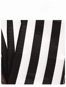 Close-up of thick soft polyester fabric with modern black and white striped pattern