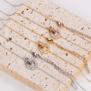 Double ring interlocking necklace in rose gold, gold, and silver with crystal pavé