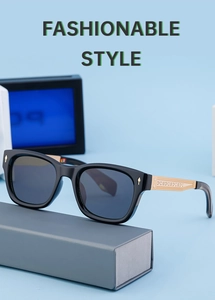 Detail of polarized black square frame sunglasses with golden metal hinges and rivets