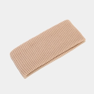 Close-up of beige ribbed knit headband showcasing soft texture and elastic weave pattern