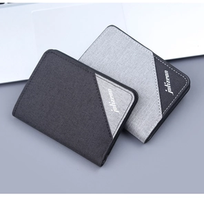 Slim canvas bifold wallet detail showing dark and light gray twill fabric texture