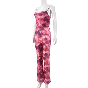 Close-up of pink and purple abstract cloud print on mesh fabric of backless jumpsuit