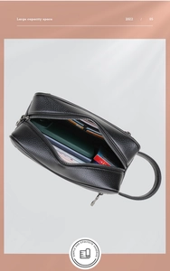 Detail view of large capacity black pebbled leather clutch with organized interior slots