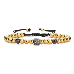 Handmade woven bracelet featuring gold copper beads and colorful micro-set zircon ball