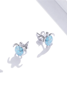 Macro view showing the S925 hallmark on blue enamel sea turtle stud earrings