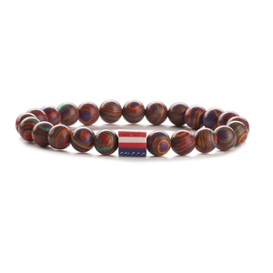 Rainbow beaded elastic bracelet with a central American flag charm on white background