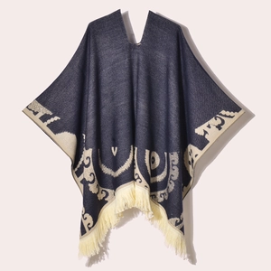Navy blue knitted poncho with beige patterns and fringe tassels for women's winter warmth