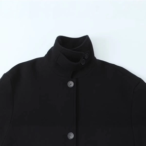 Short black wool coat with stand-up collar and button details for women in casual style