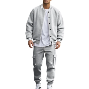 Detailed view of gray fleece baseball jacket and matching cargo joggers on male model