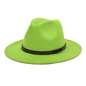 Detail of lime green wool fedora hat featuring a black leather band with metallic studs