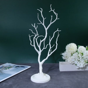 White coral tree jewelry display stand for necklaces and earrings on a round base