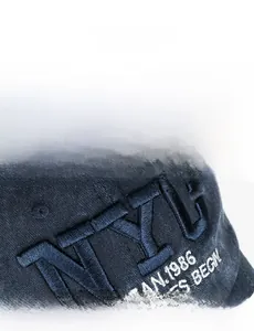 Close-up of 3D NYC embroidery on vintage washed cotton twill baseball cap detail
