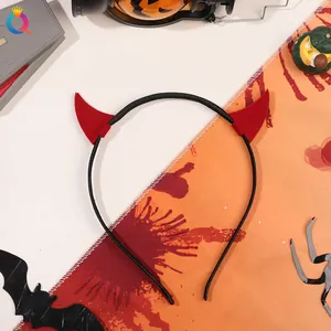 Halloween devil horn headband with red horns and black band on festive background