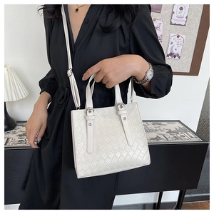 Elegant white quilted leather handbag for women featuring a woven pattern and shoulder strap