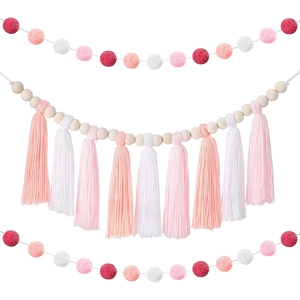 Nordic wall hanging with pink felt balls, wooden beads and soft decorative tassels