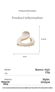 Detail view of cream white irregular alloy hair claw showing 6cm width dimensions