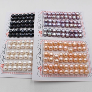 Assorted natural freshwater bread pearls in white, black, purple, and orange on display cards