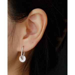 Elegant S925 sterling silver hoop earrings with diamond gear pendant on model
