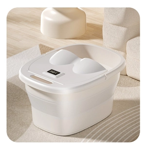 Detail of folding foot bath basin showing digital temperature display and splash cover