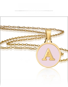 Close-up of 18K gold plated stainless steel necklace with pink shell letter A pendant