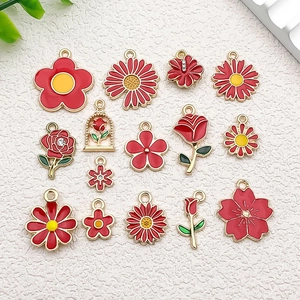 Detailed set of red enamel flower charms with gold edges for DIY jewelry making and crafts
