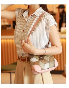 Close-up of geometric pattern shoulder bag with pink leather trim and textured patches