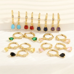Detailed macro view of 18K gold-plated earrings with vibrant colorful teardrop zircon gems
