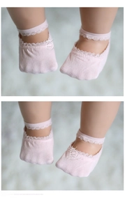 Pink cotton baby boat socks with delicate lace trim and elastic straps for infant girls