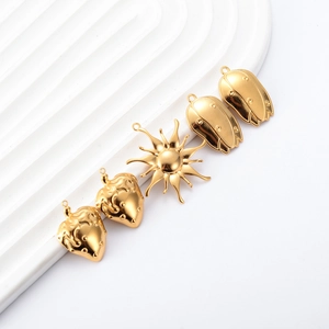 Vintage 18k gold plated strawberry, sun, and tulip pendants for DIY jewelry making