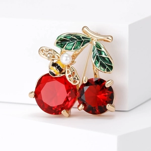 Fashionable cherry brooch with red crystal rhinestones and a small pearl bee accent