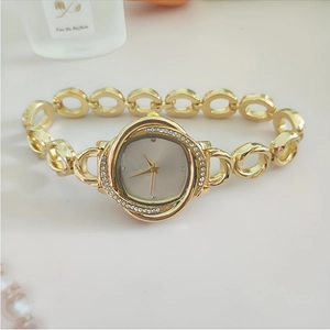 Elegant gold women's quartz watch with oval diamond bezel and hollow chain bracelet