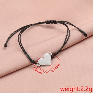 Polished stainless steel heart pendant bracelet with adjustable black braided rope cord